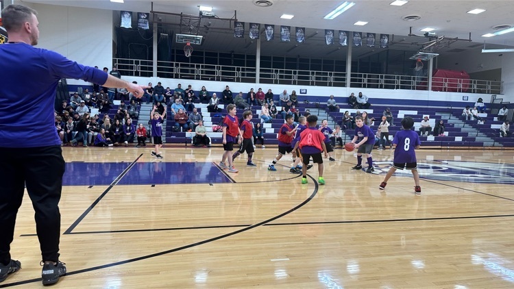 Elementary students playing basketball