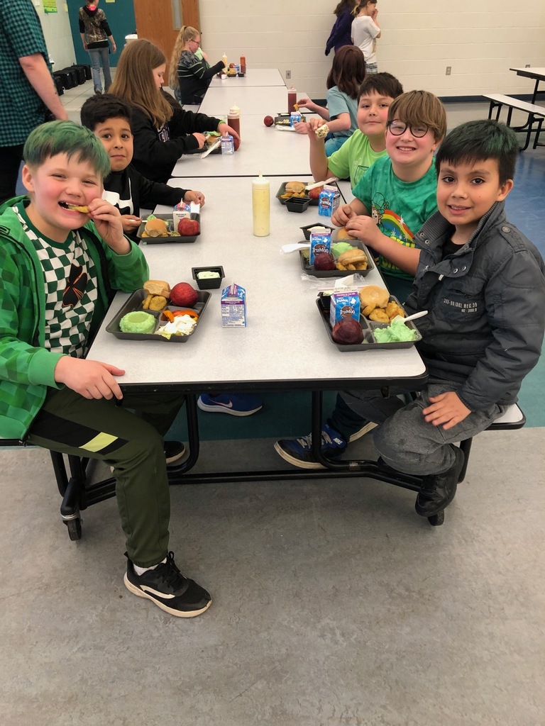 Students enjoying a green twist with their mash potatoes and gravy.