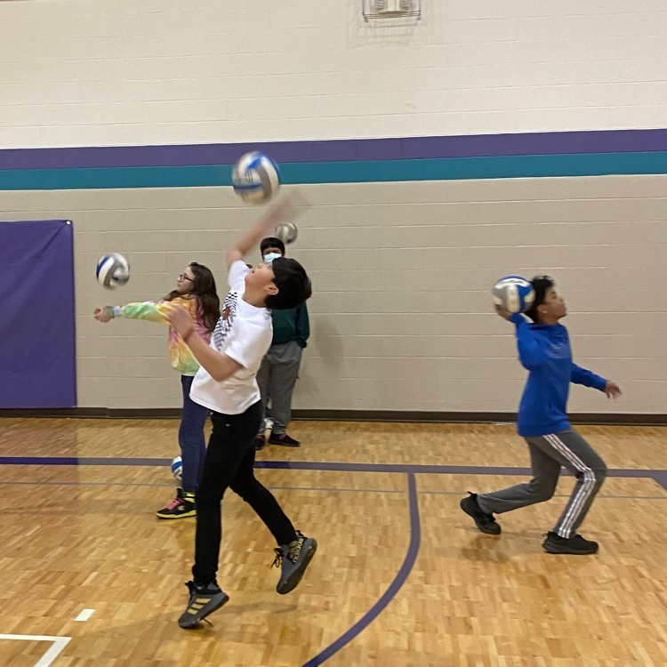 student playing volleyball 